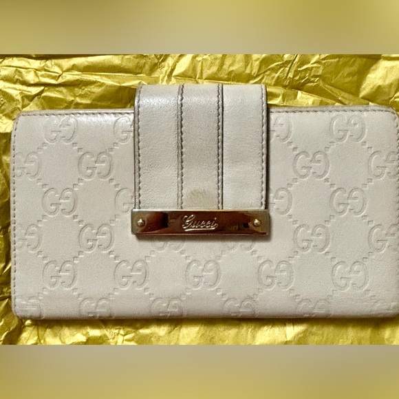 Gucci Handbags - Gucci Cream Embossed Women's Wallet